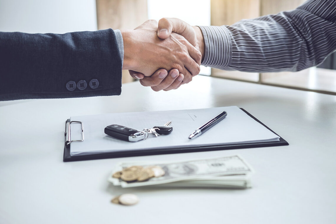 Customer shaking hands with salesperson at a RAM dealership