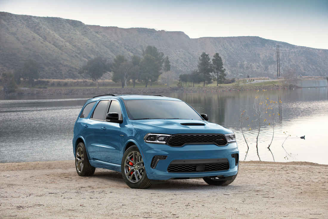 A new Dodge model parked near a lake